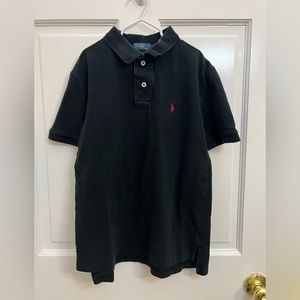 Boys short sleeve polo shirt. Size medium. Black. Gently used.